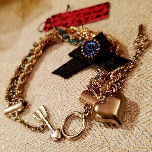 Add a touch of whimsy and elegance with this vintage-style Betsey Johnson bracel